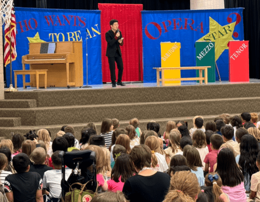 students watching a Utah Opera member